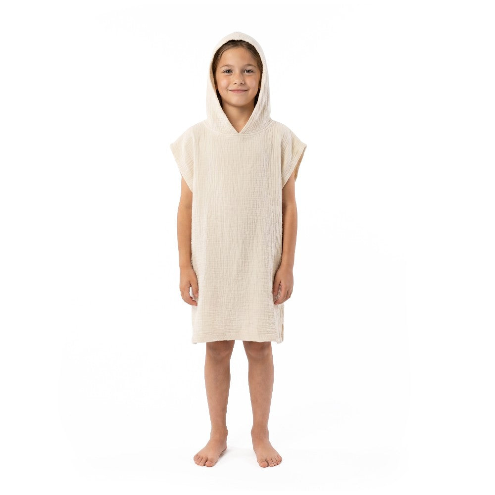 Child wearing a white NIXY Flow Kids Turkish cotton changing poncho