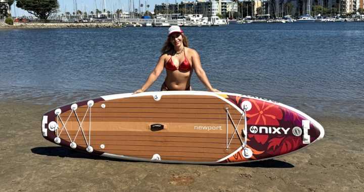 NIXY Newport G5 inflatable paddleboard on the water — lightweight all-around SUP for stability, performance, and adventure