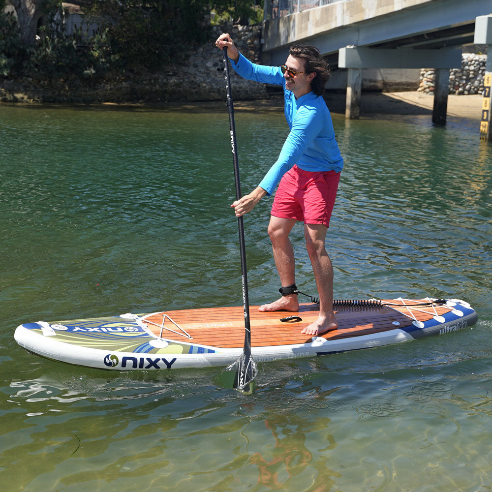 NIXY Newport G5 inflatable paddle board in Bora Bora on the water