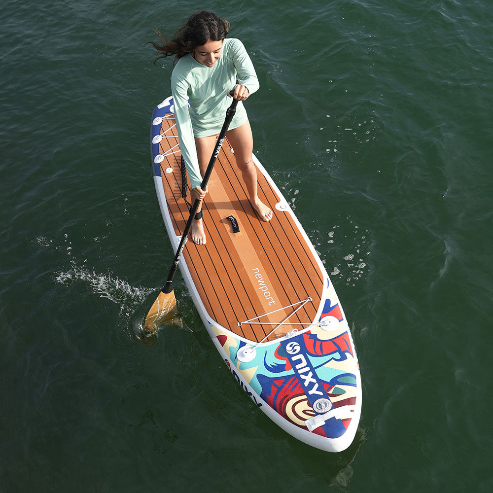 NIXY Newport G5 All-Around Paddle Board, a paddler stroking across open water seen from above
