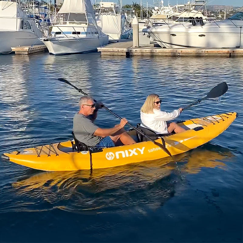 NIXY Tahoe Inflatable Kayak, two-person inflatable kayak being paddled on open water