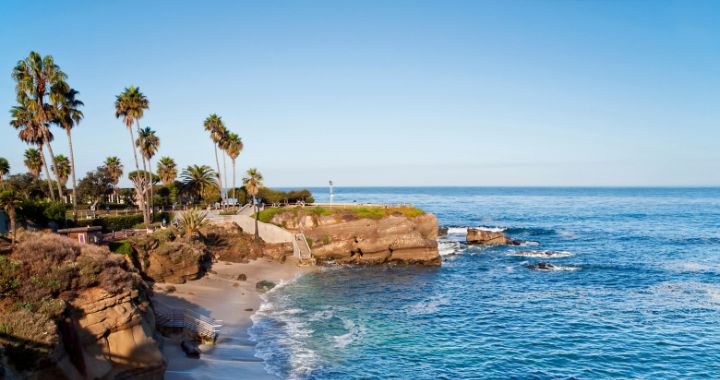 Beautiful landscape photo of La Jolla, California showcasing its calm paddleboarding waters.
