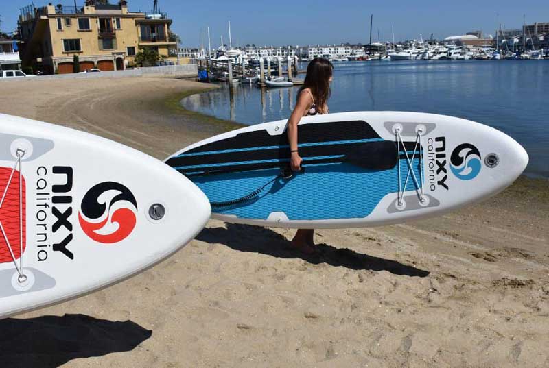 Paddler enjoying a NIXY inflatable paddle board on the water