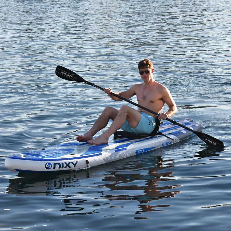 NIXY Kayak conversion blade for paddleboard paddles being used on the water