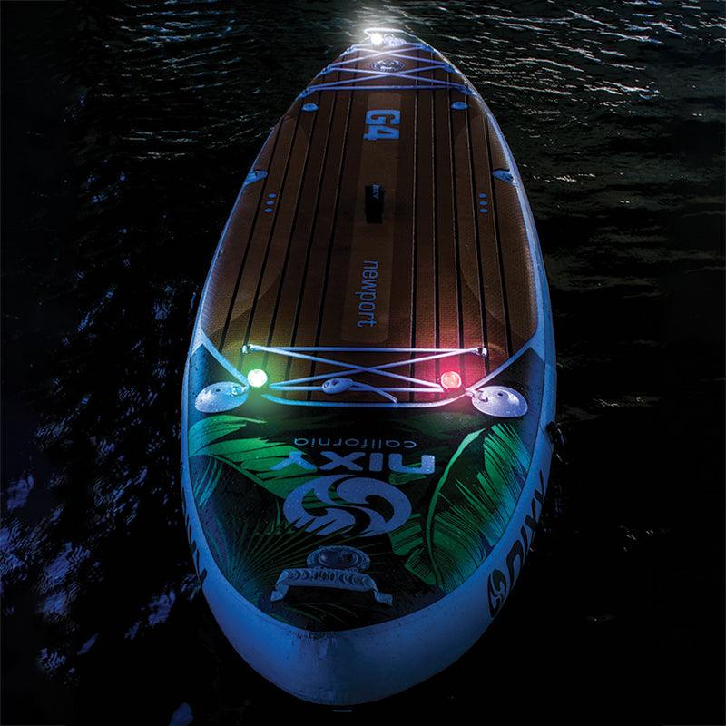 NIXY paddle board navigation lights glowing in the dark