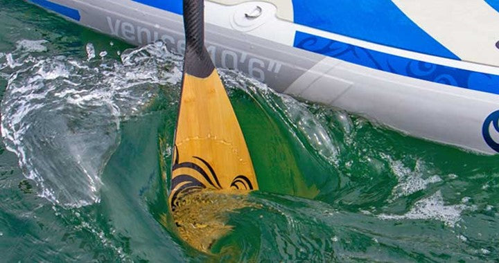 Action shot of a NIXY Carbon fiber SUP paddle