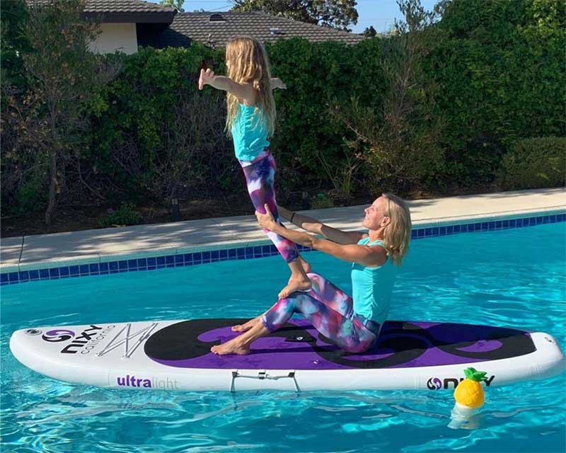 The Connelly girls paddle boarding in the sun