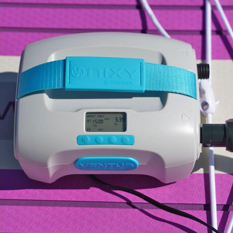 NIXY Ventus electric pump inflating a pink paddle board to 15 PSI