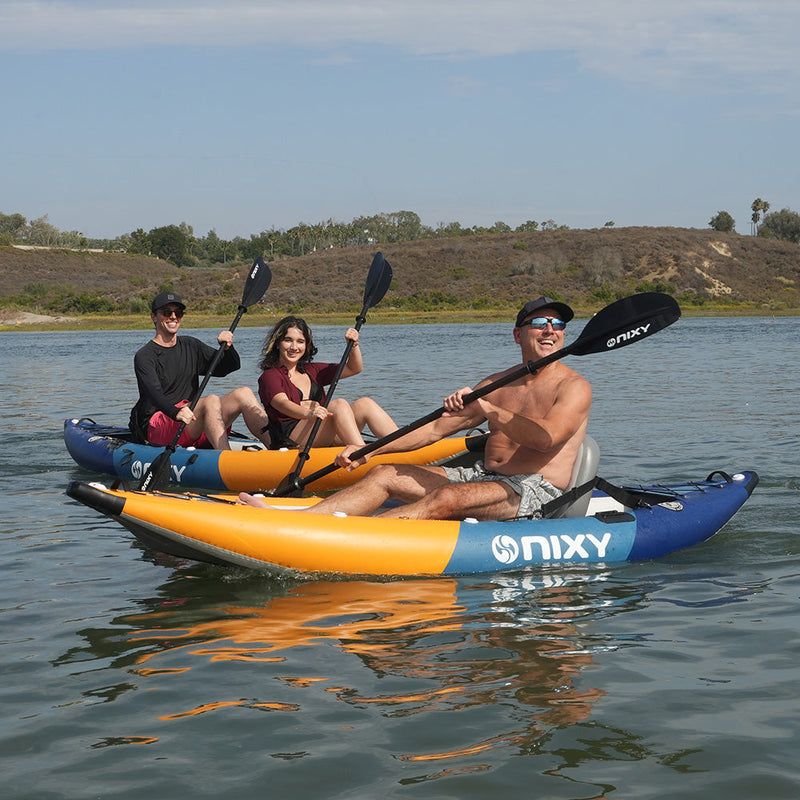 NIXY Tahoe 114 solo and 150 double inflatable kayaks on the water next to each other