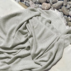 Textured towel with chevron pattern on pebbles