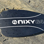 Lightweight 3-piece hybrid carbon fiber paddle resting on the sand at the beach