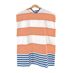 Landon Kids Turkish Cotton Poncho with orange, white, and blue striped pattern on a wooden hanger against a white background