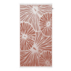 Turkish cotton beach towel with red and white abstract citrus pattern on a white background