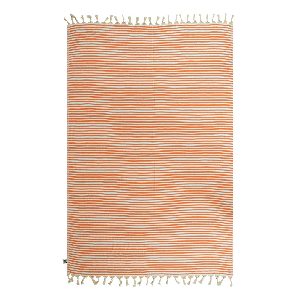 Striped NIXY Mediterranean (Orange) oversized Turkish cotton beach towel with tassels on a white background
