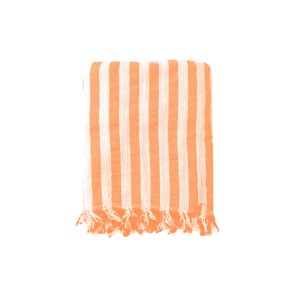 NIXY Melody recycled Turkish cotton folded beach towel with vertical orange and off-white stripes and fringed edges, shown on a plain white background.