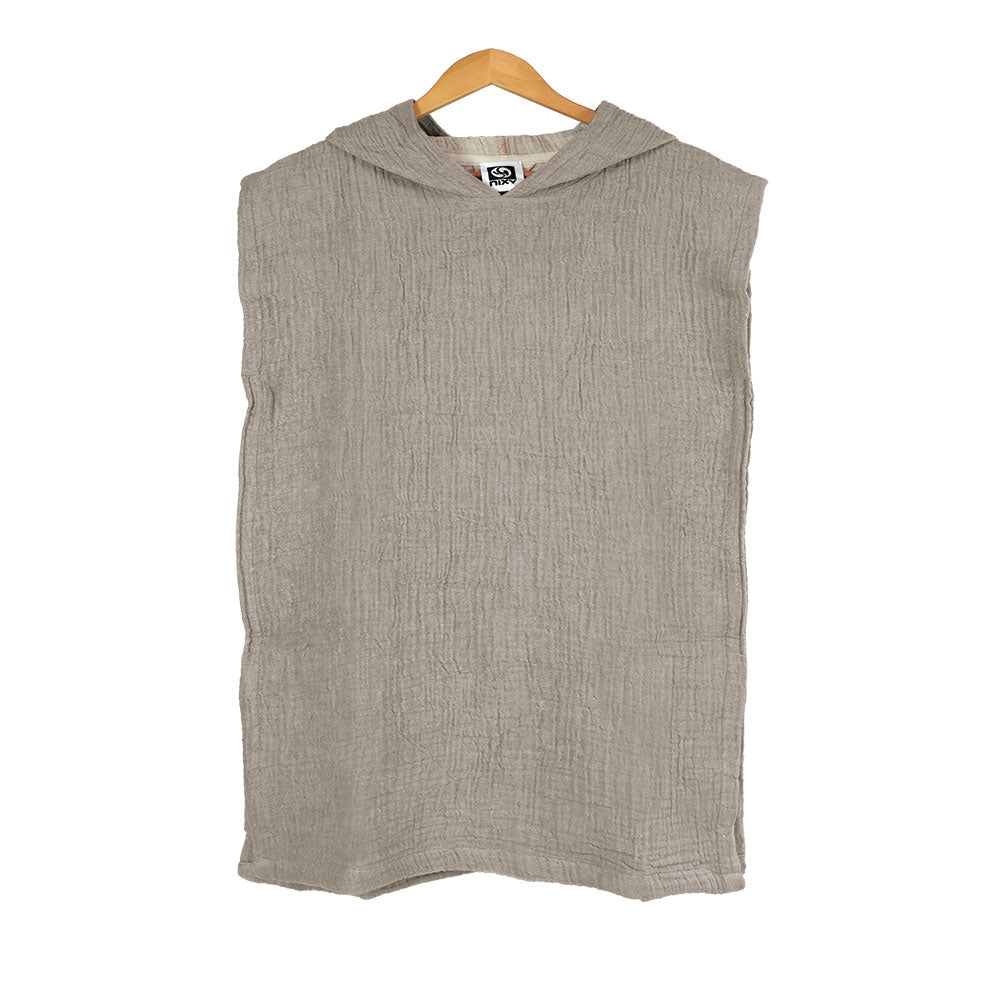 Olive sleeveless Turkish cotton changing poncho for kids on a wooden hanger against a white background