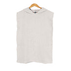 White hooded Turkish cotton NIXY changing poncho for kids on a wooden hanger against a white background