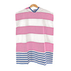 Pink and white striped kids' Turkish cotton changing poncho with blue accents on a hanger against a white background
