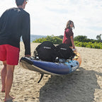 NIXY Tahoe 150 double kayak being carried to the water by a man and woman