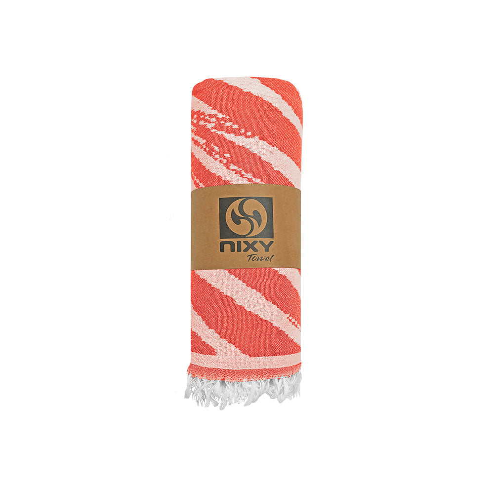 NIXY Palm Turkish Beach Towel in Bright Red, palm-leaf pattern laid flat on a white background