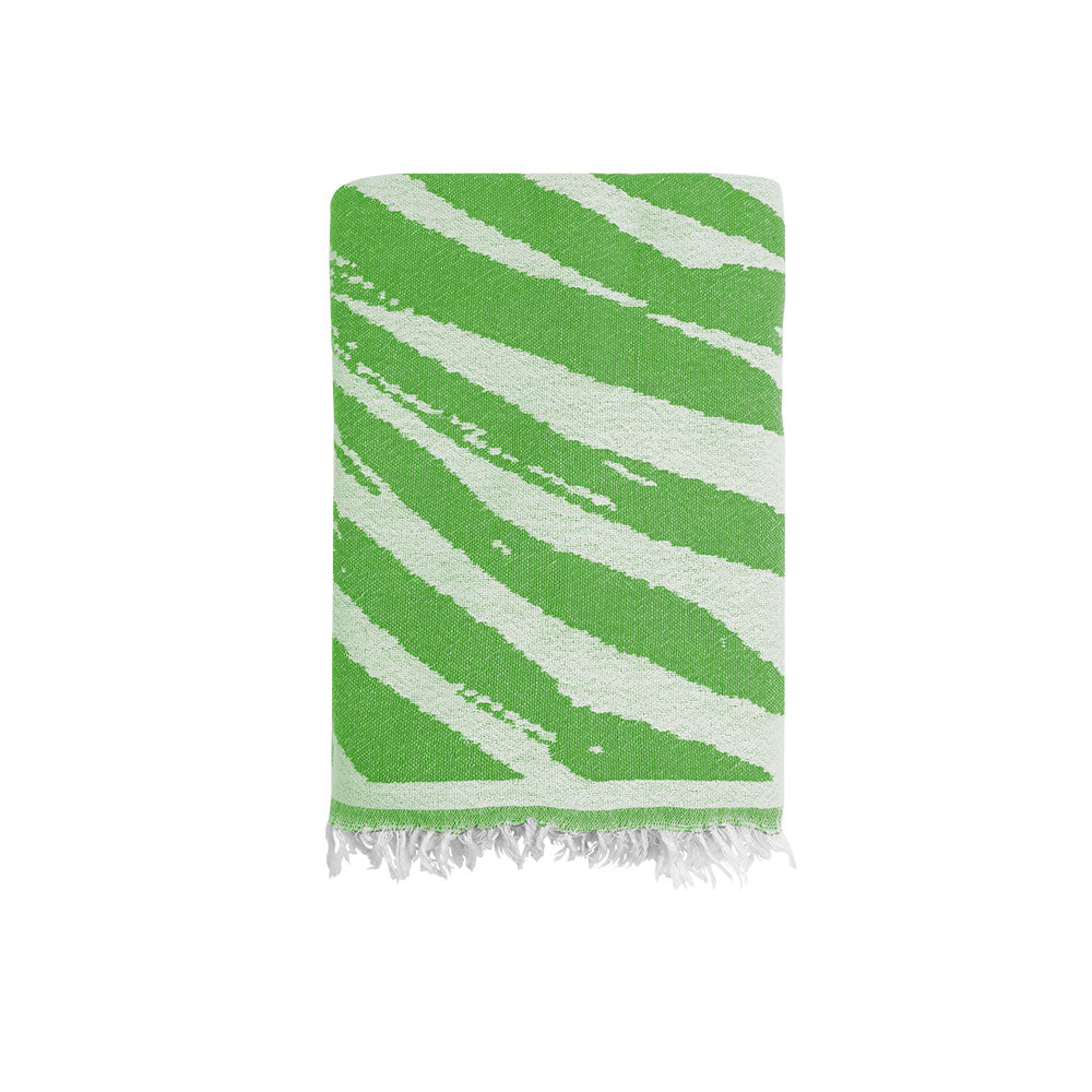 Close-up of the NIXY Palm Turkish Beach Towel in Lime, 100% Turkish cotton weave with palm-leaf print