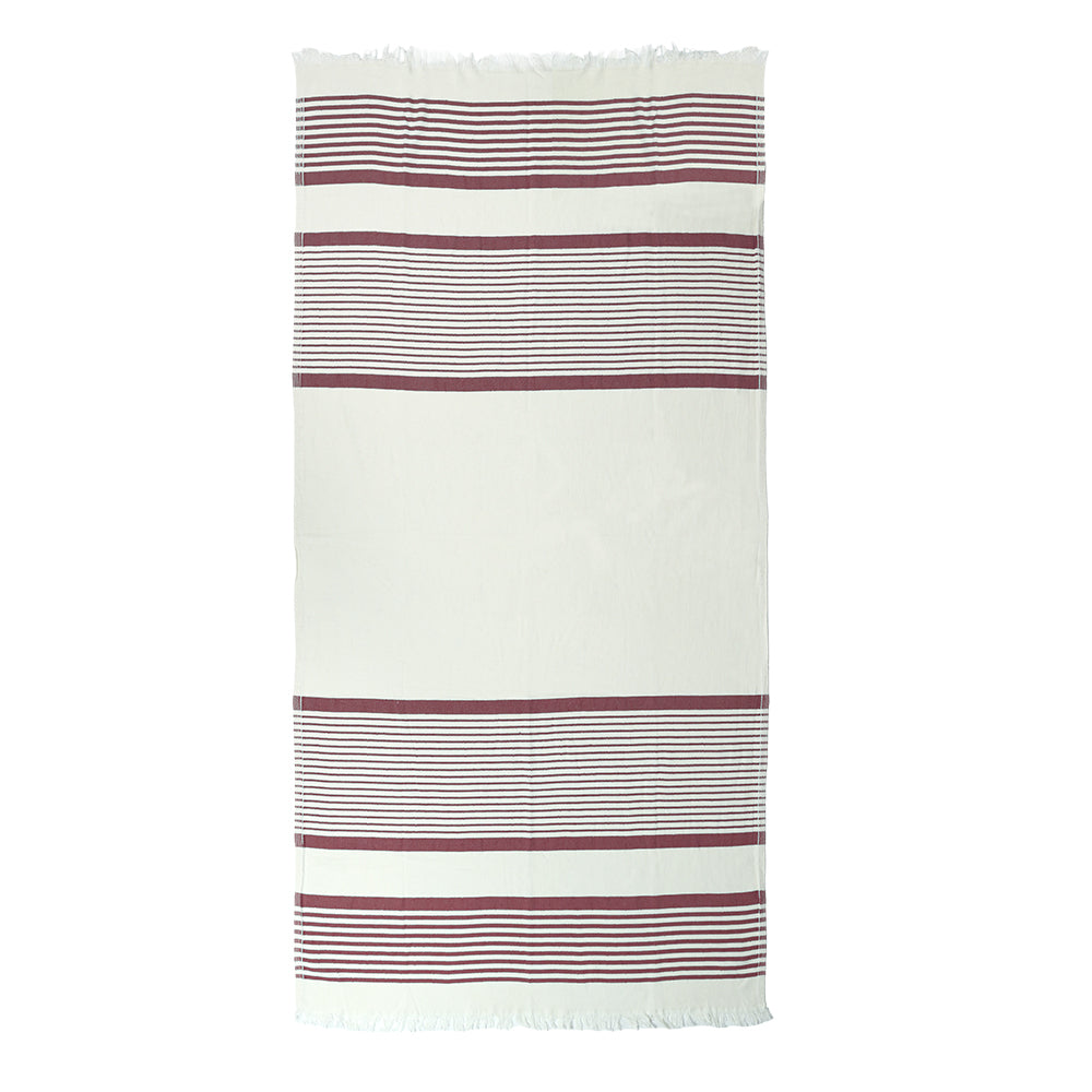 Wine red striped Shoreline Turkish cotton beach towel with white tassels on a white background