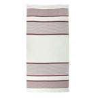 Wine red striped Shoreline Turkish cotton beach towel with white tassels on a white background
