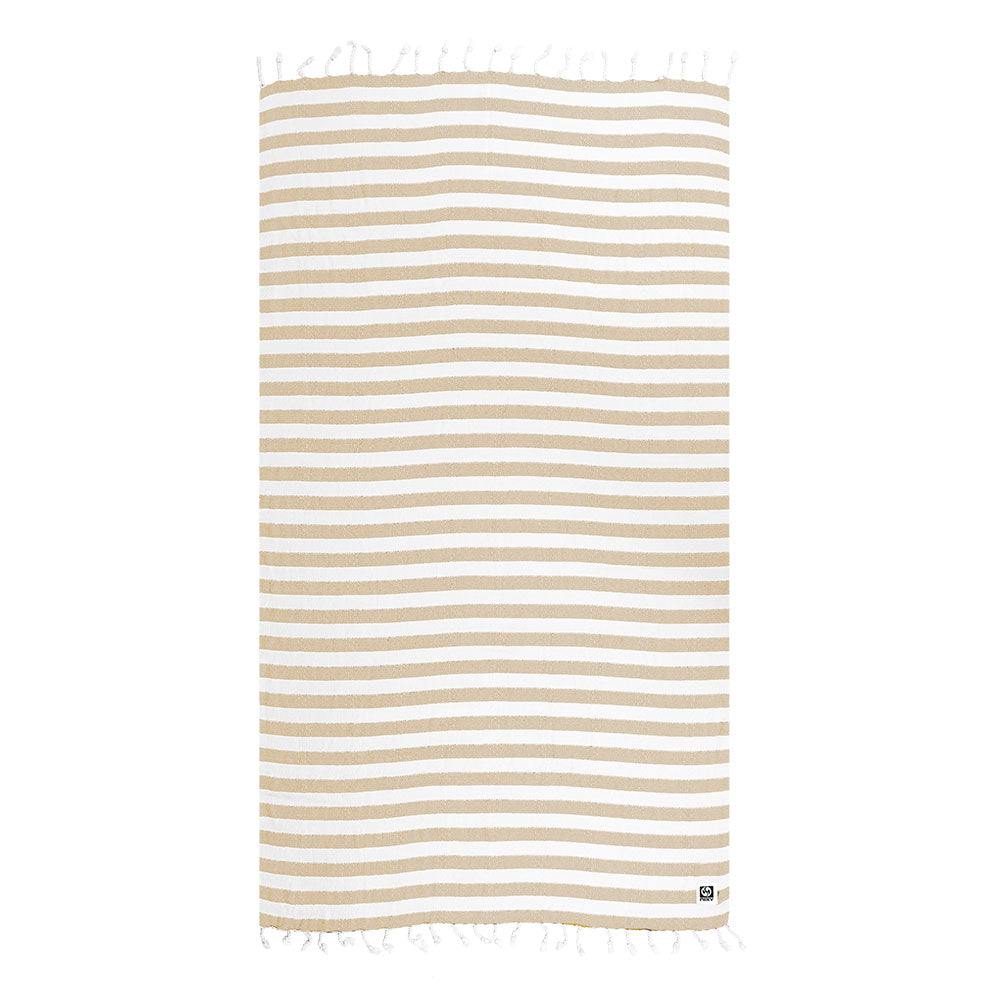 NIXY Acelia Bamboo Turkish Beach Towel in Beige, bamboo-cotton blend with striped pattern laid flat on a white background