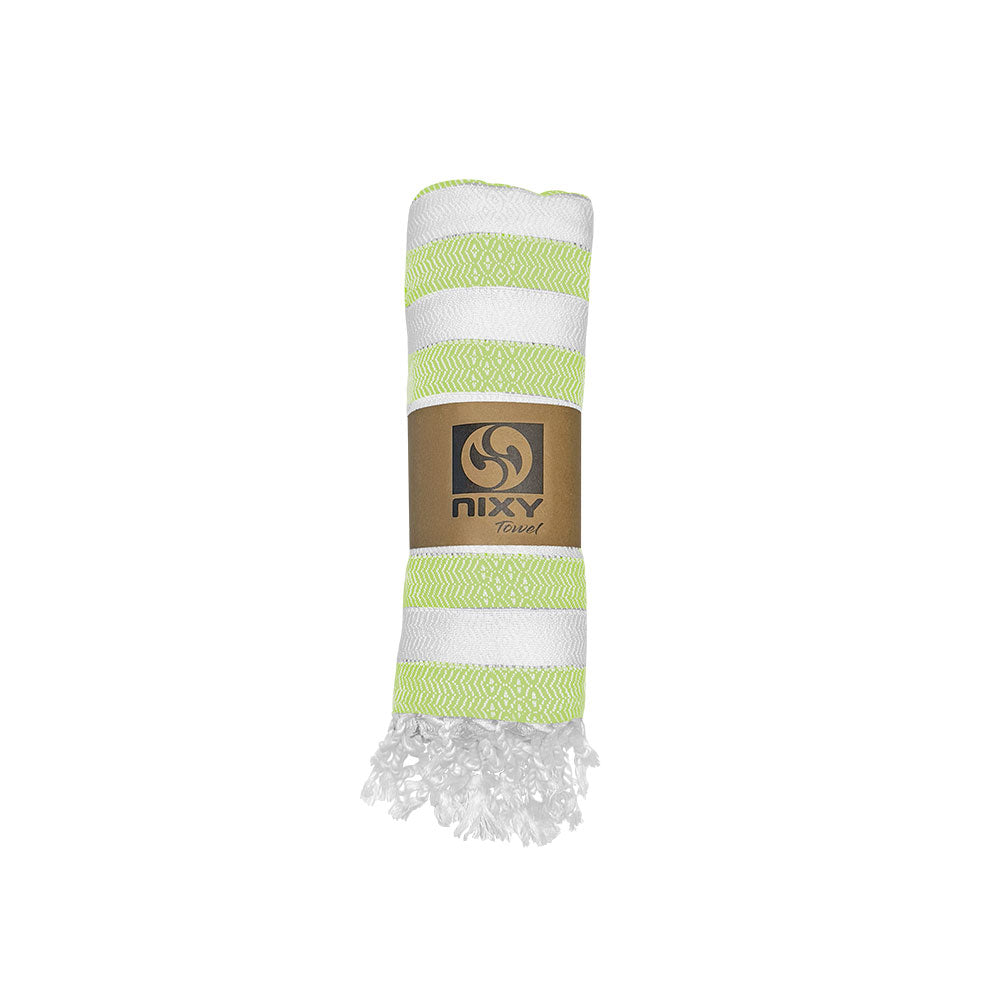 NIXY Acelia Bamboo Turkish Beach Towel in Lime rolled and styled on a white background