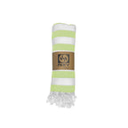 NIXY Acelia Bamboo Turkish Beach Towel in Lime rolled and styled on a white background