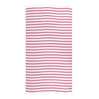 Striped Turkish cotton and bamboo beach towel with pink and white stripes on a white background