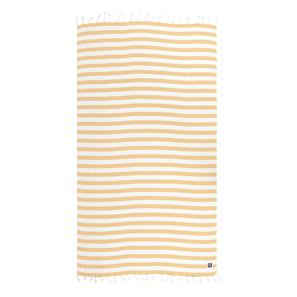 Striped yellow and white Turkish cotton and bamboo beach towel with tassels on a white background