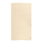 Striped yellow and white Turkish cotton and bamboo beach towel with tassels on a white background