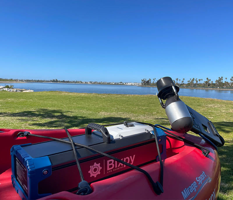 Red kayak with Bixpy electric motor and battery.