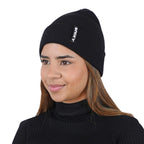 Woman wearing black NIXY Sports classic cuffed knit beanie with black turtleneck – sleek women's winter hat for cold-weather fashion and outdoor sports