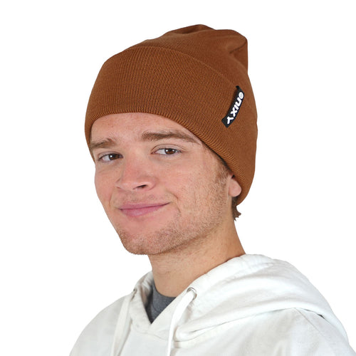Man wearing golden brown NIXY Sports classic cuffed knit beanie with white hoodie – men's ribbed winter hat for casual and cold-weather outdoor wear