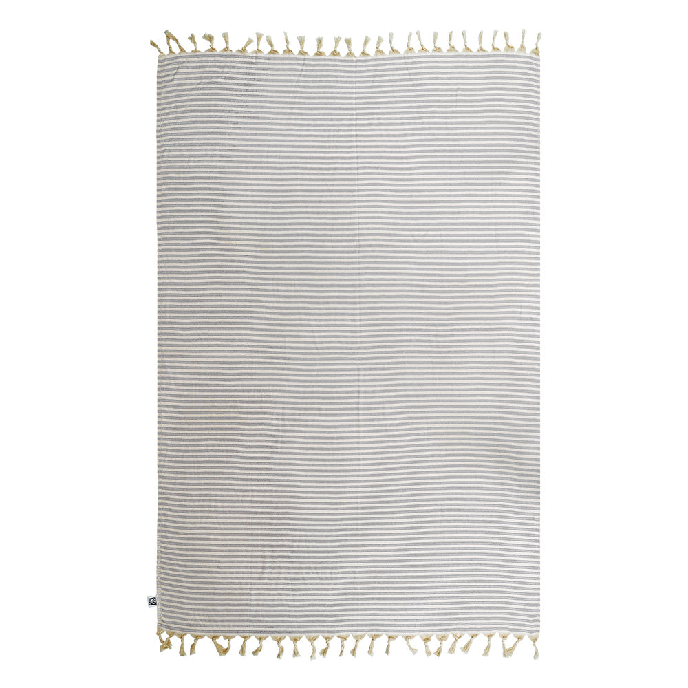 Striped NIXY Mediterranean Turkish cotton beach towel (Silver) with tassels on a white background showcasing it flat woven and sand-resistant.