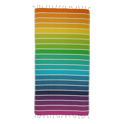NIXY Rainbow Turkish Beach Towel laid flat, layered rainbow stripe pattern in vivid colors on a white background