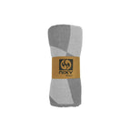 NIXY Squares Recycled Turkish Beach Towel in Gray rolled and styled on a white background