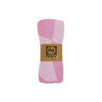 NIXY Squares Recycled Turkish Beach Towel in Pink rolled and styled on a white background