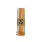 NIXY Vintage Turkish Beach Towel rolled and styled on a white background, travel-ready Turkish cotton