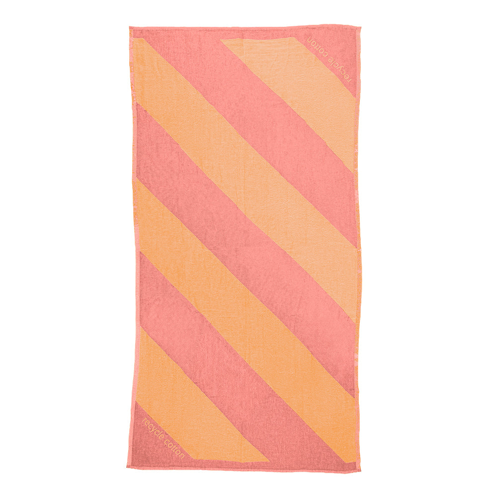NIXY Parallax Recycled Turkish Cotton Beach Towel (Coral Yellow). A rectangular beach towel with bold diagonal stripes in pink and yellow, shown flat against a white background.
