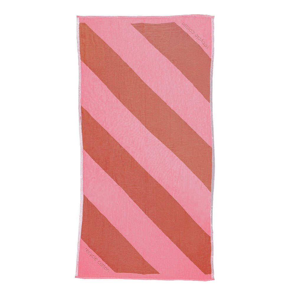 NIXY Parallax Recycled Turkish Cotton Beach Towel (Terracotta). A rectangular beach towel with bold diagonal stripes in terracotta and pink, shown flat against a white background.