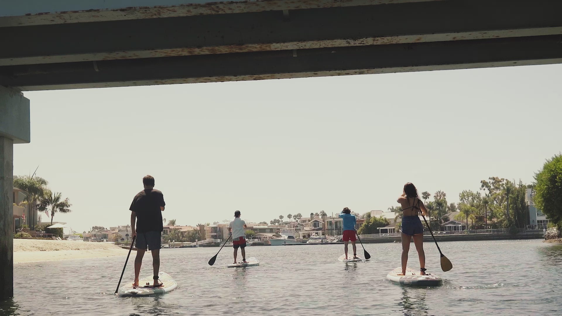 Lifestyle video of NIXY G5 Monterey inflatable stand-up paddleboard. The isup is shown being unrolled and inflated.