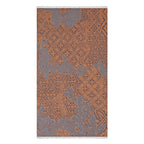 Patterned towel with brown and gray design on a white background