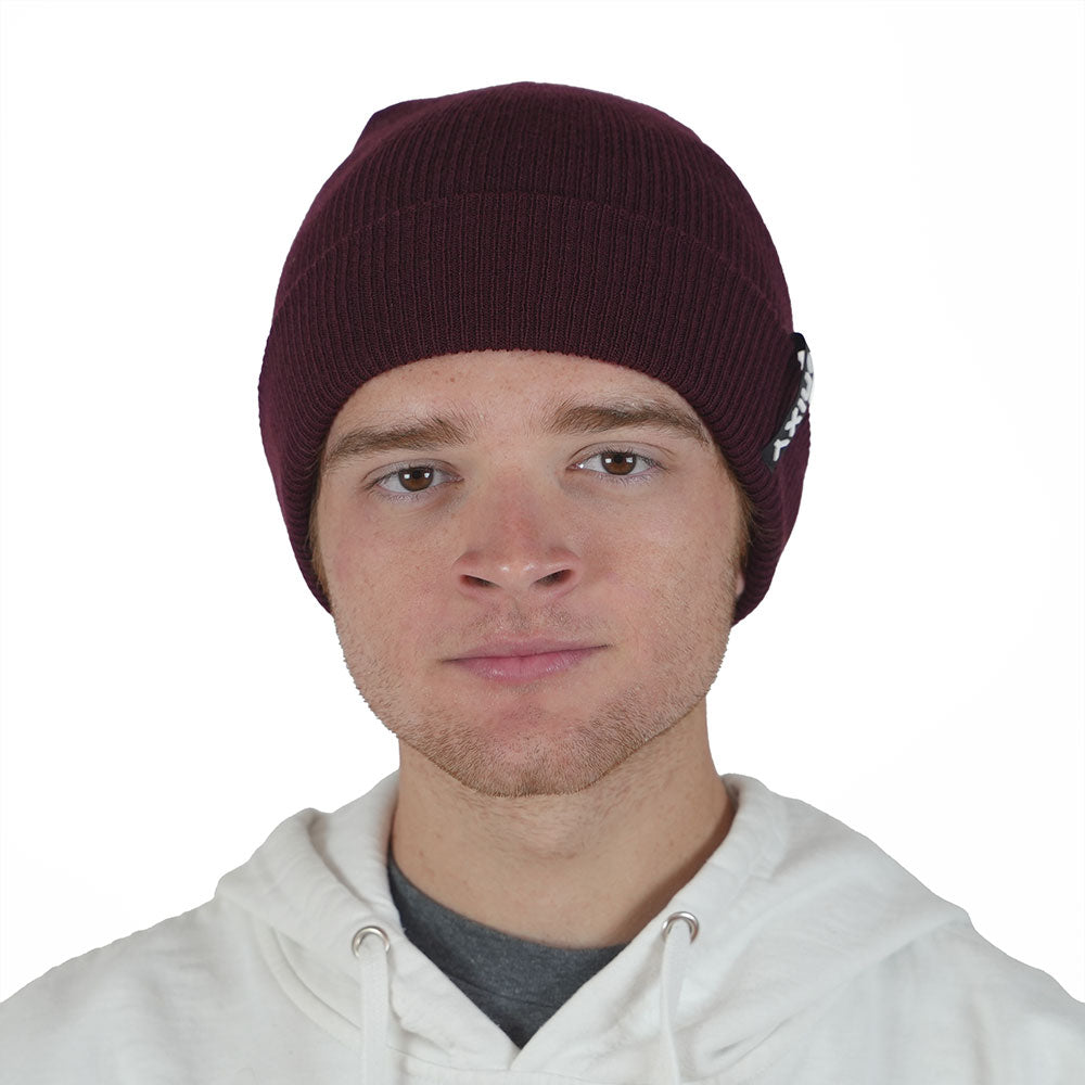 Man wearing merlot maroon NIXY Sports skull beanie with white hoodie – men's slouchy uncuffed winter hat for casual and cold-weather outdoor wear