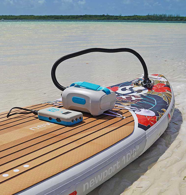 Inflatable paddleboard being inflated by NIXY Ventus electric pump