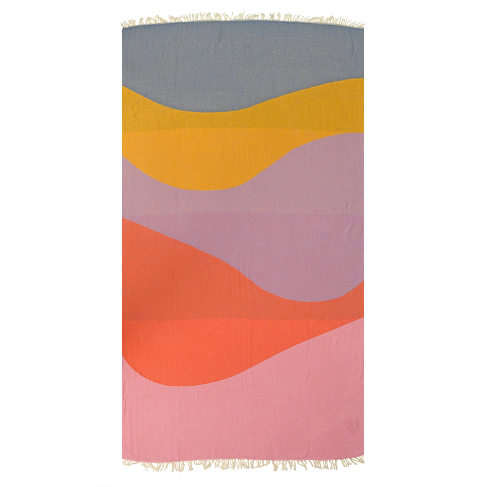 Colorful Turkish cotton beach towel with wavy pattern on a white background