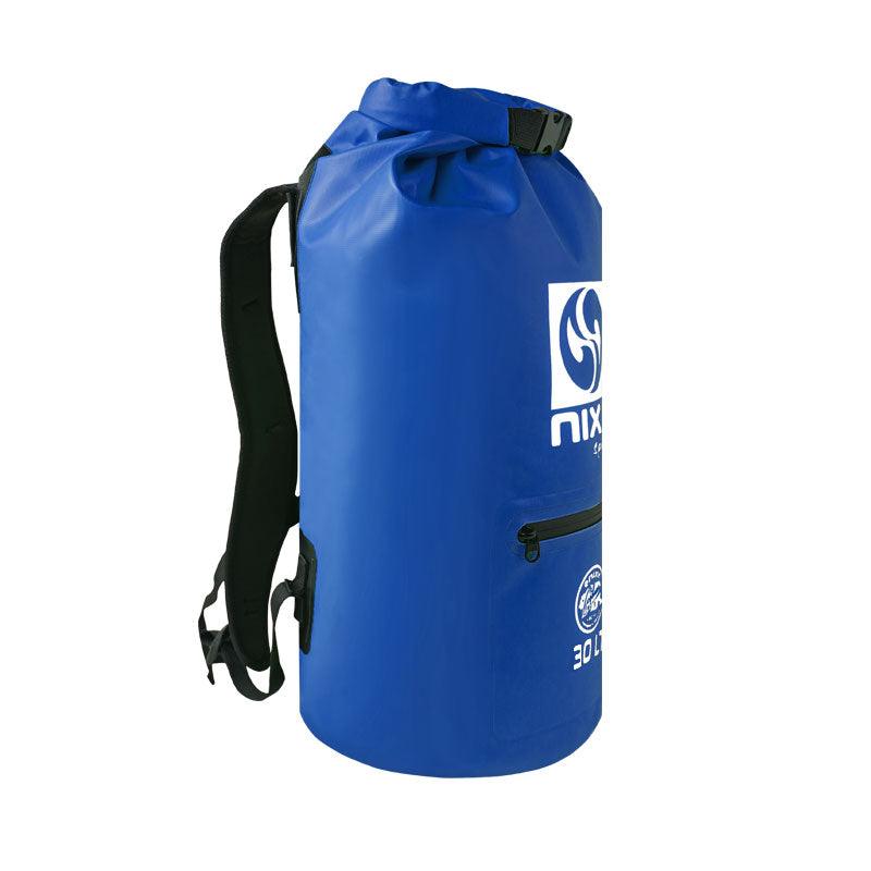NIXY 30L Waterproof Dry Bag Backpack in Blue, side view showing padded adjustable backpack strap, roll top closure and zippered side pocket, floating waterproof backpack for paddleboarding, SUP, kayaking and outdoor adventures