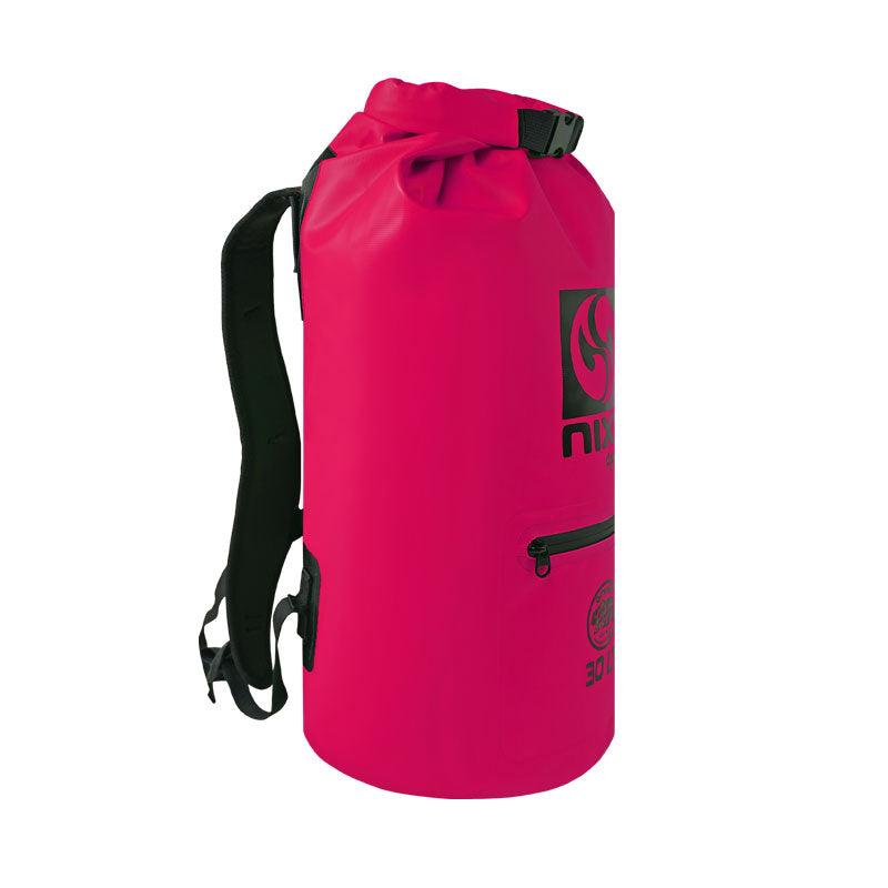 NIXY 30L Waterproof Dry Bag Backpack in Fuchsia, side view showing padded adjustable backpack strap, roll top closure and zippered side pocket, floating waterproof backpack for paddleboarding, SUP, kayaking and outdoor adventures